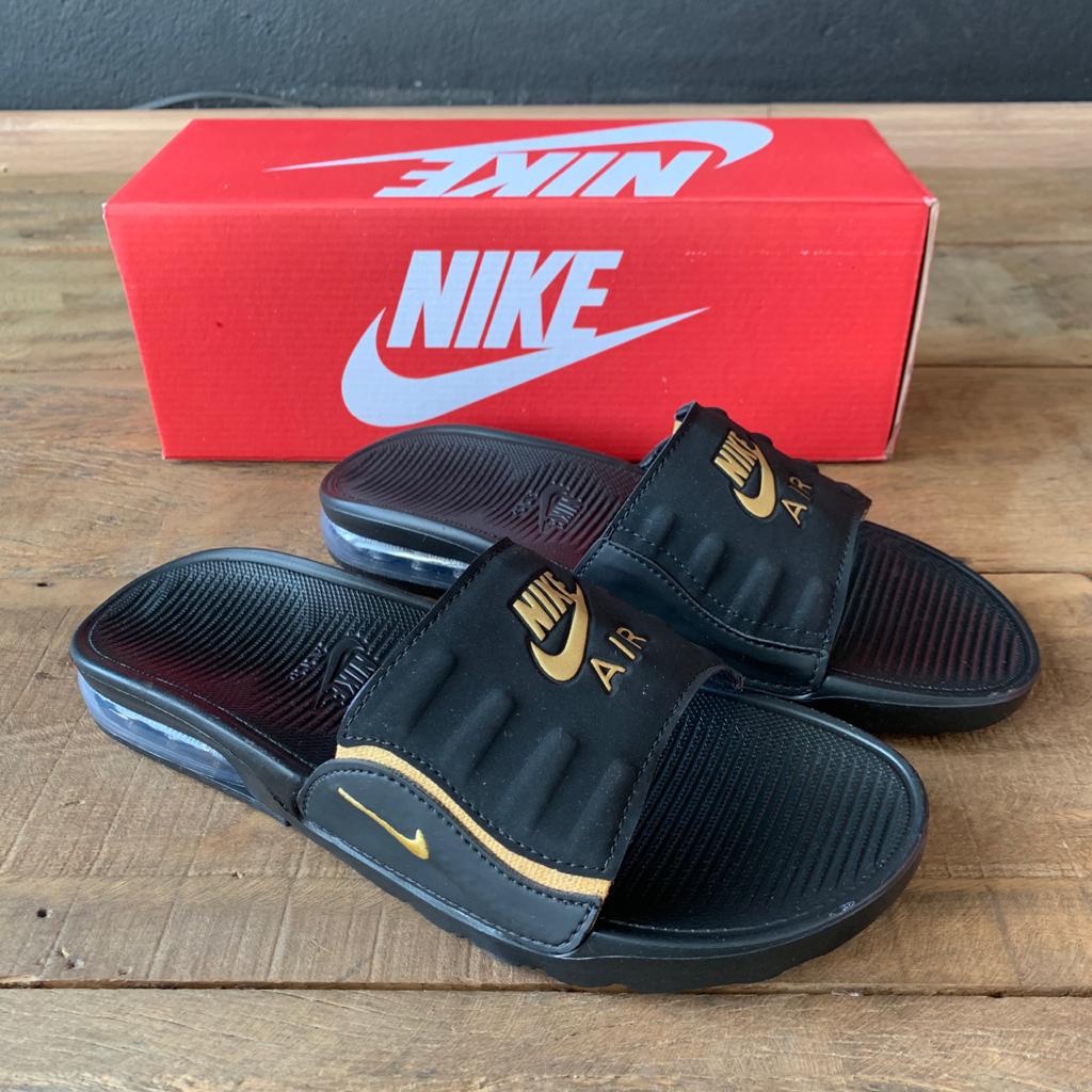 chinelo nike simbolo dourado