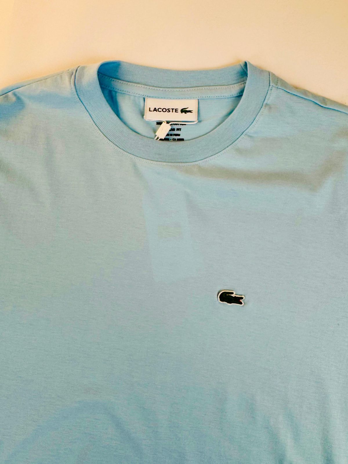 Camiseta Lacoste com Bag - SP GRIFES - Camisetas Importadas no Atacado