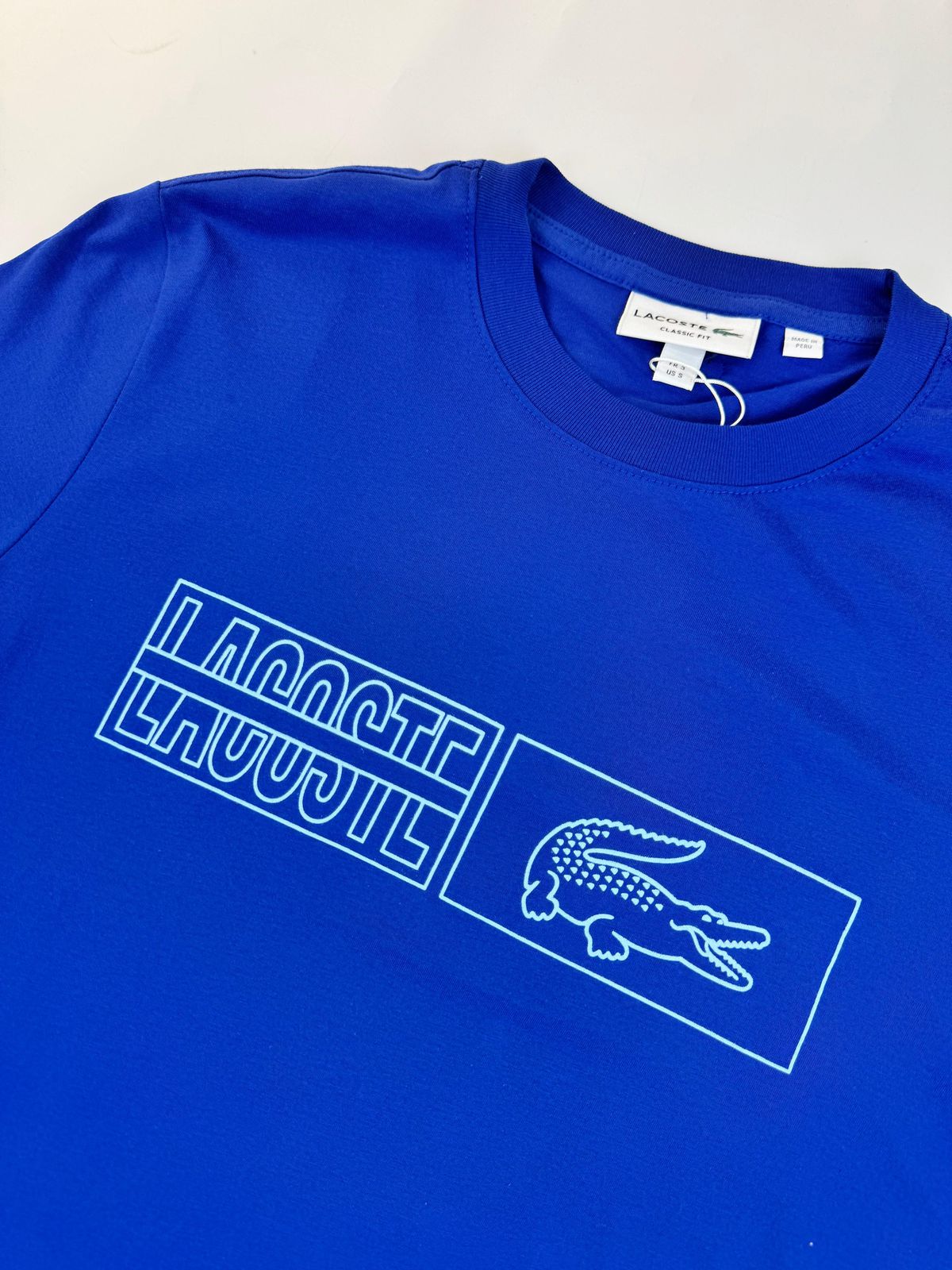 Camiseta Lacoste com Bag - SP GRIFES - Camisetas Importadas no Atacado