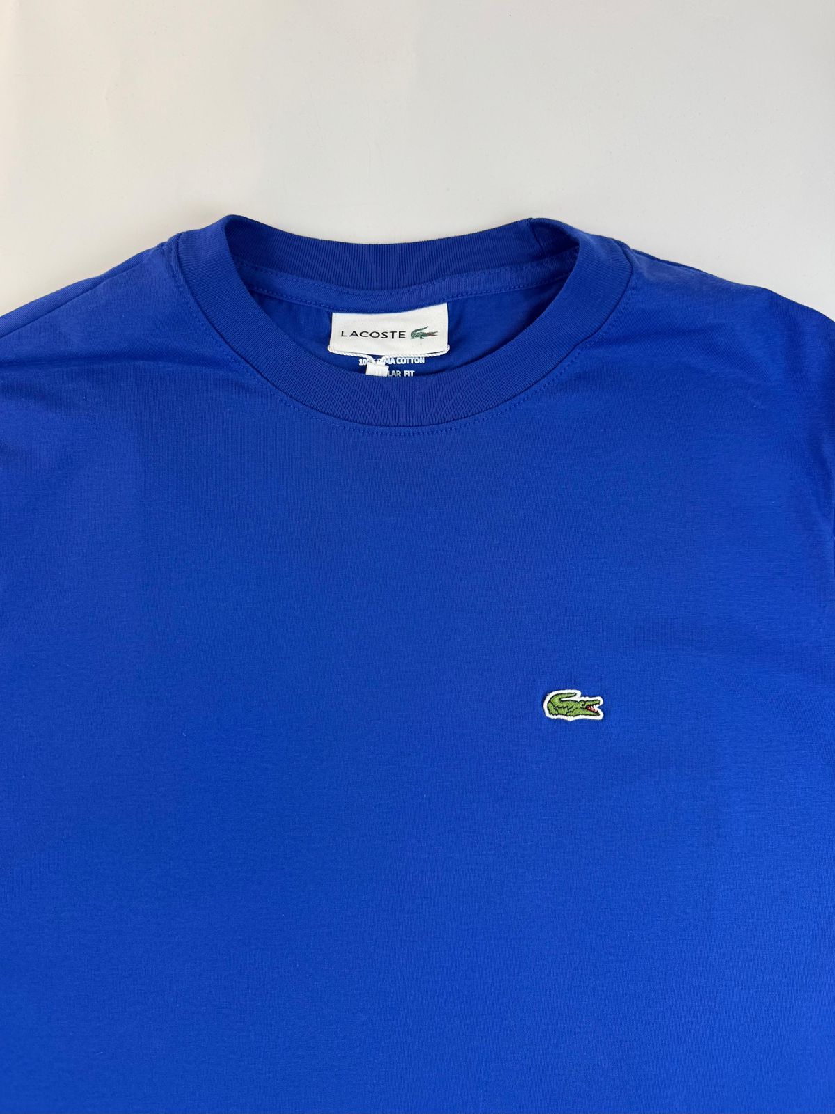 Camiseta Lacoste com Bag - SP GRIFES - Camisetas Importadas no Atacado