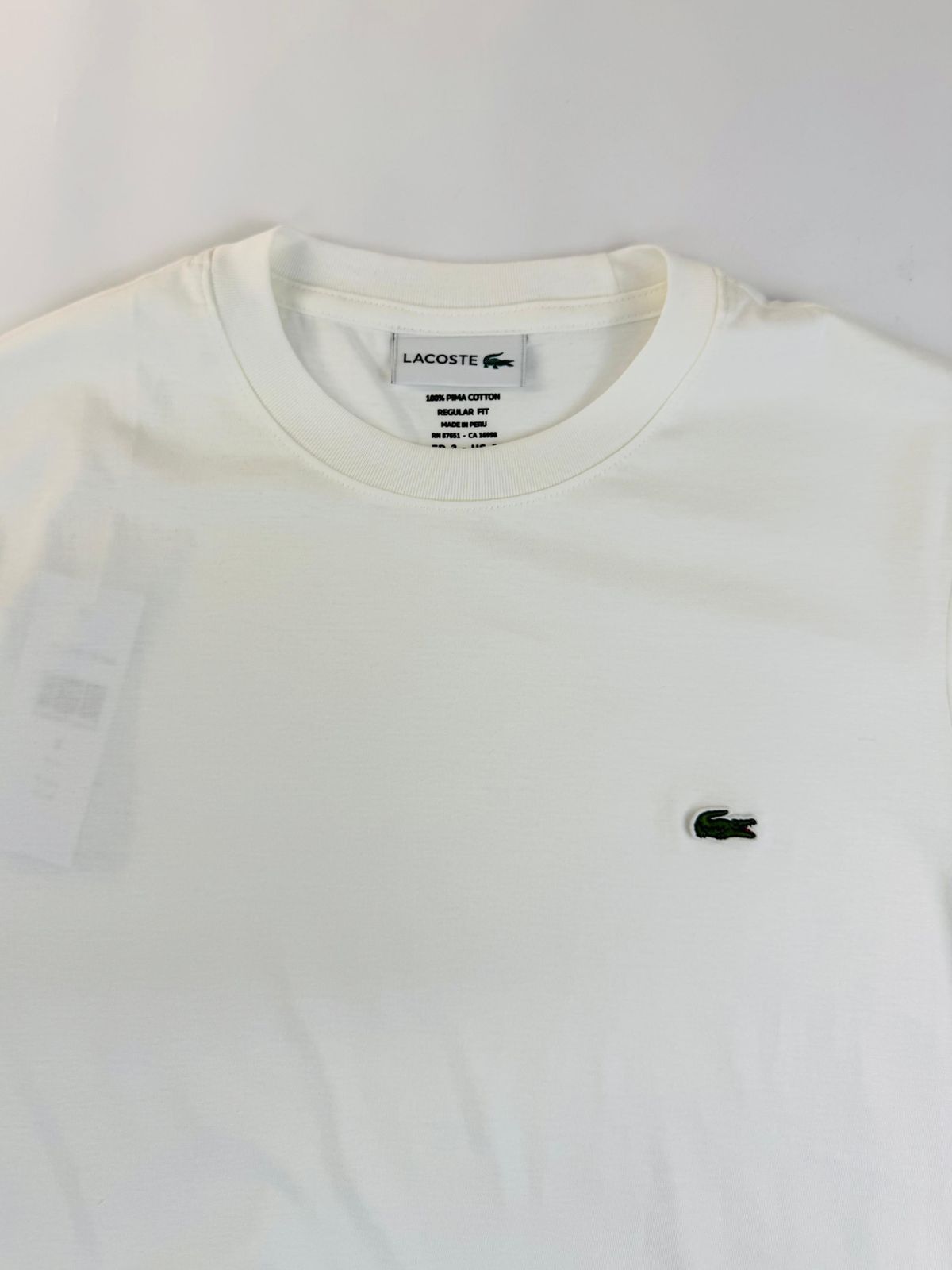 Camiseta Lacoste com Bag - SP GRIFES - Camisetas Importadas no Atacado