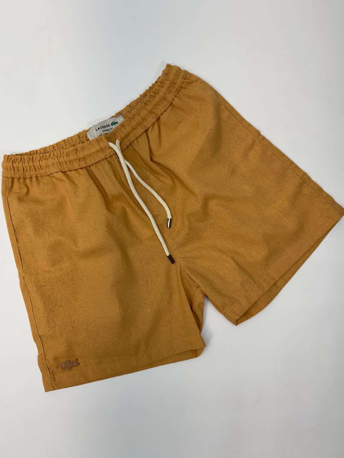 SHORT LACOSTE - SP GRIFES - Camisetas Importadas no Atacado