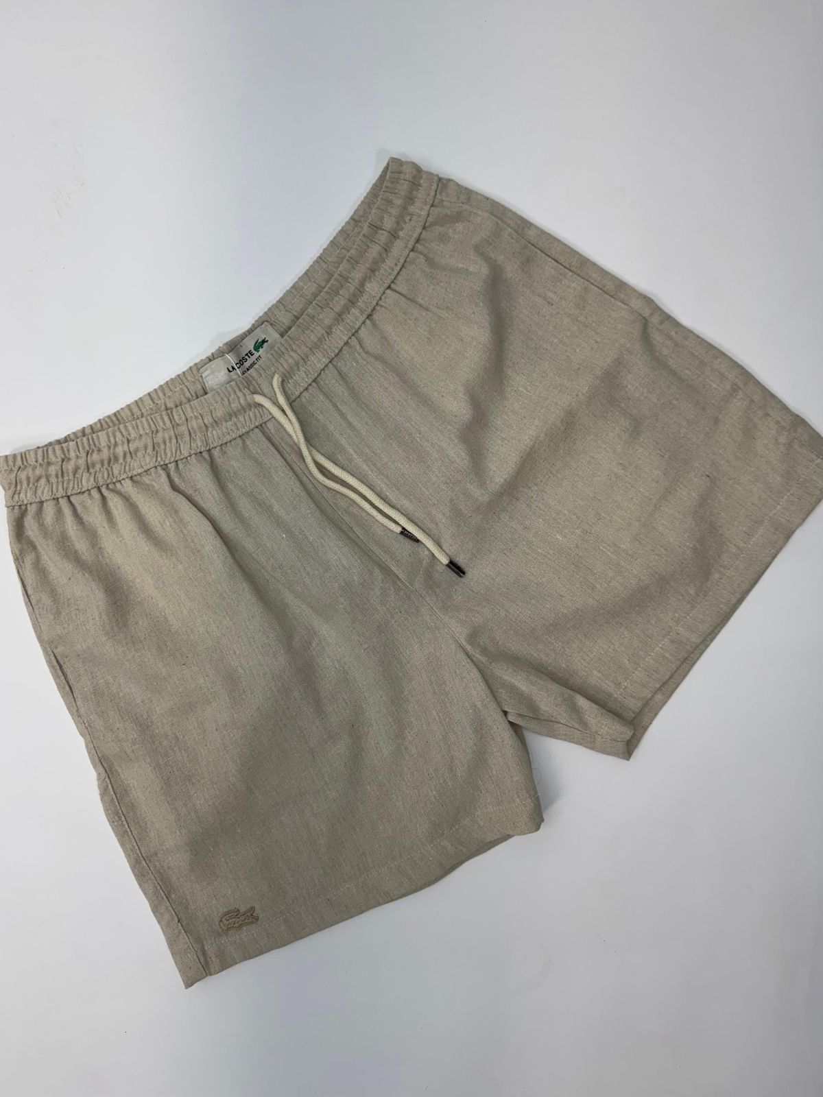 SHORT LACOSTE - SP GRIFES - Camisetas Importadas no Atacado