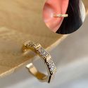 Piercing fake escamas cravejadas