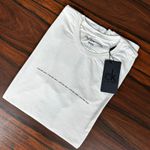 Camiseta CK Off White DFC. 