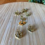 Aplique âncora dourado 1x1,3cm 10un