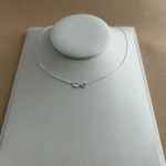 COLAR CORAÇÃO VAZADO METADE MINI ZIRCÔNIA E GARRINHAS 