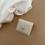 ANEL CORAÇÃO VAZADO COM MINI ZIRCÔNIA AZUL CLARO LATERAL LARGA