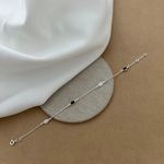 PULSEIRA COM ZIRCÔNIA OVAL BRANCA E PRETO COM BORDA