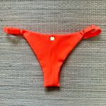 Tanga Fio em Dobra Com Regulagem Laranja Textura
