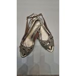 sapatilha dourada aberta de laço