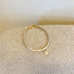 Pulseira Abraço- banho ouro 18k
