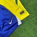 (VAZADO) Conjunto Infantil Brasil Home I - Copa do Mundo 2026 – Amarelo/Azul 