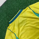 Camisa Brasil Home I - Copa do Mundo 2026 – Amarela – Feminina