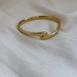 Bracelete Rígido Cruzado Smooth em Aço Inox Dourado