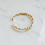 Bracelete Rígido Cruzado Smooth em Aço Inox Dourado