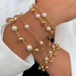 Pulseira de perola e esferas (cada)