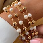 Pulseira de perola e esferas (CADA)