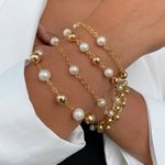 Pulseira de perola e esferas (cada)