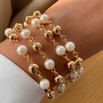 Pulseira de perola e esferas (CADA)
