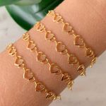 Pulseira de coração vazado (cada) 