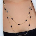 Colar alongado com detalhes pretos 60cm (cada)