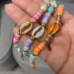 Tornozeleira búzio azul