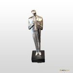 ESTATUETA FIGURA DE MUSICO CROMADO