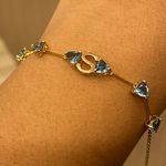 Pulseira de Ouro 18K com Letra S e Pedras Topázio Azul