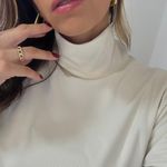 Blusa Ravena off white textura com bolsos e gola alta Trituê 