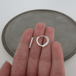 ARGOLINHA COM 7 ZIRCÔNIAS OVAL COM GARRINHAS