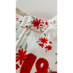 Macacão malha premium off white e vermelho floral Kiko Baby