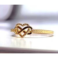 Anel em Ouro 18k Coração Vasado Trançado