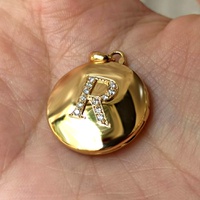 Relicário em Ouro 18k Redondo cravejado com Diamantes 