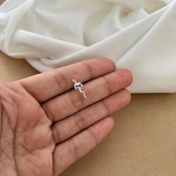 PIERCING PARA TRAGUS COM COBRINHA ENROLADA CRAVEJA... - C Martiniano Joias