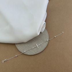 PULSEIRA CRUZ DEITADA 4 BOLINHAS COM ELOS ALONGADO... - C Martiniano Joias