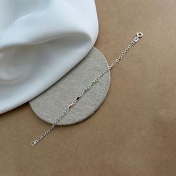 PULSEIRA COM 4 ZIRCÔNIAS NAVETE COLORS BORDA ARGOL... - C Martiniano Joias