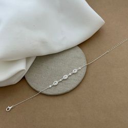PULSEIRA COM 3 ZIRCÔNIAS OVAIS CRISTAL LATERAL CRA... - C Martiniano Joias