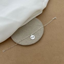 PULSEIRA PLAQUINHA REDONDA INFINITO VAZADO - 26637 - C Martiniano Joias
