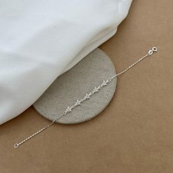 PULSEIRA COM 5 ESTRELINHAS DE ZIRCÔNIA CRISTAL BOR... - C Martiniano Joias