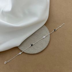 PULSEIRA COM ZIRCÔNIA OVAL BRANCA E PRETO COM BORD... - C Martiniano Joias