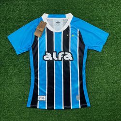 Camisa Grêmio Home I 25/26 Umbro Torcedor Feminina... - CATALOGO