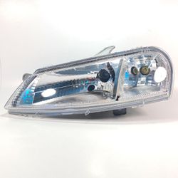 Farol Esquerdo Celta Original Arteb - 0160391 - 79... - Franpel Distribuidora de Peças Automotivas