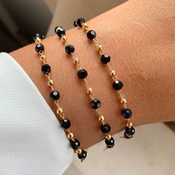 Pulseira de esfera lisa e detalhes preto (CADA) - ... - Lojas das Revendedoras