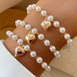 Pulseira infantil de perola com coração (cada) - P... - Lojas das Revendedoras