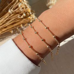 Pulseira com bolinhas delicada (cada) - P49 - Lojas das Revendedoras