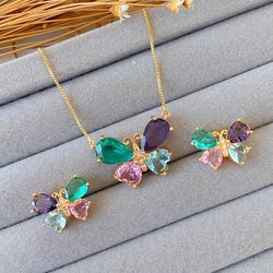 Conjunto de borboleta na zircônia colorida - CON7... - Lojas das Revendedoras