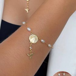 Pulseira de perola nossa senhora com espirito sant... - Lojas das Revendedoras