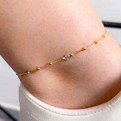 Tornozeleira De Bolinha Com Detalhe De Ponto De Lu... - Lojas das Revendedoras