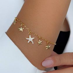Pulseira de estrelas com detalhes na micro zircôni... - Lojas das Revendedoras